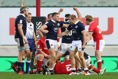 LLANELLI, WALES - OCTOBER 31: James Lang of Scotland (2L) celebrates with Scott Steele of Scotland as a penalty is awarded in final play to secure victory in  the 2020 Guinness Six Nations match between Wales and Scotland at Parc y Scarlets on October 31, 2020 in Llanelli, Wales. Sporting stadiums around the UK remain under strict restrictions due to the Coronavirus Pandemic as Government social distancing laws prohibit fans inside venues resulting in games being played behind closed doors. (Photo by David Rogers/Getty Images)