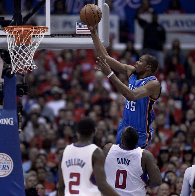 Kevin Durant goes to the basket during the Oklahoma City Thunder's victory over the Los Angeles Clippers in Game 3 on Friday night. Paul Buck / EPA / May 9, 2014 