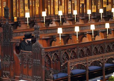 Queen Elizabeth sits alone in St George's Chapel at the funeral of Prince Philip. AP