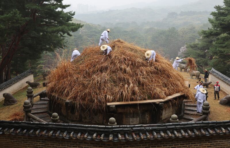Workers cut the grass at the Geonwonneung tomb of King Taejo, founder of the Joseon Dynasty, in Guri, east of Seoul, South Korea, marking the Hansik holiday. EPA