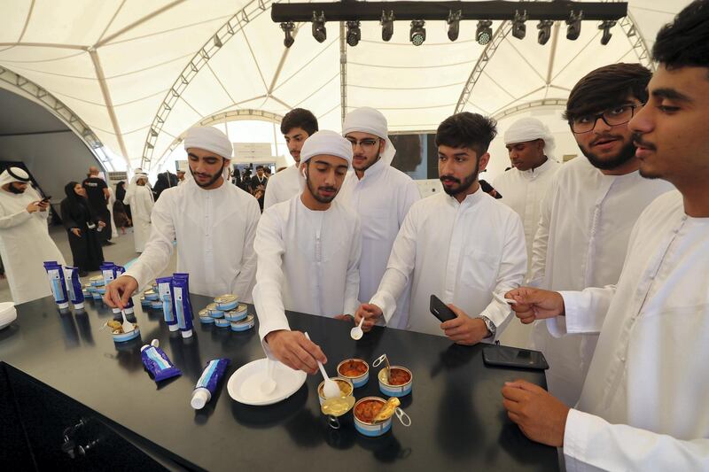Dubai, United Arab Emirates - September 27, 2019: People eat space food. Live call with Hazza Al Mansouri. The Emirati astronaut will be answering some questions from space. Friday the 27th of September 2019. Mohammed Bin Rashid Space Centre, Dubai. Chris Whiteoak / The National