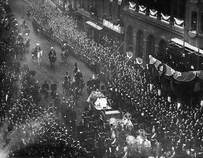 Crowds line the streets to watch the funeral cortege of Queen Victoria in 1901. Getty Images