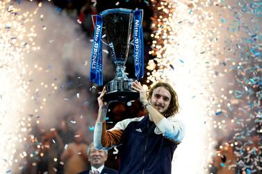 epa08004791 Stefanos Tsitsipas of Greece lifts his trophy after winning the final match against Dominic Thiem of Austria at the ATP World Tour Finals tennis tournament in London, Britain, 17 November 2019. EPA/WILL OLIVER