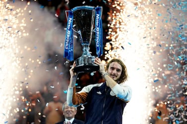 epa08004791 Stefanos Tsitsipas of Greece lifts his trophy after winning the final match against Dominic Thiem of Austria at the ATP World Tour Finals tennis tournament in London, Britain, 17 November 2019. EPA/WILL OLIVER