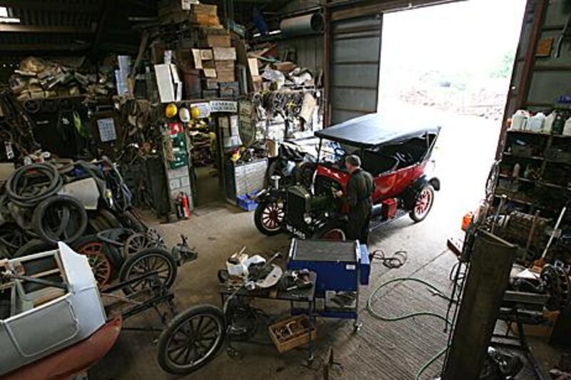 Neil Tuckett, below, has been amassing Model Ts and their parts at his shop in North Marston, England, since he restored his second old Ford in 1981.