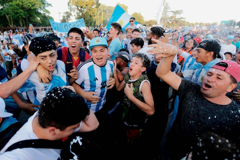 Argentina fans await the arrival of the football team in Ezeiza, Buenos Aires. AFP