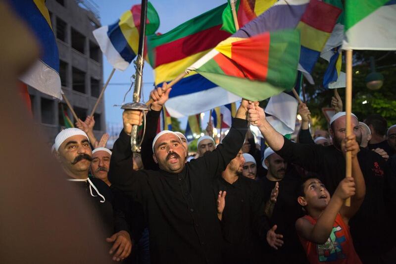 Israelis of the Druze minority during a demonstration in the northern Israeli Druze town of Daliyat Al Carmel on June 14, 2015, calling for the Israeli government to support and help their relatives in embattled Syria. Syrians on their way to an Israeli hospital were attacked on Tuesday by Druze who are traditional allies of Syrian president Bashar al Assad. Menahem Kahana/AFP Photo