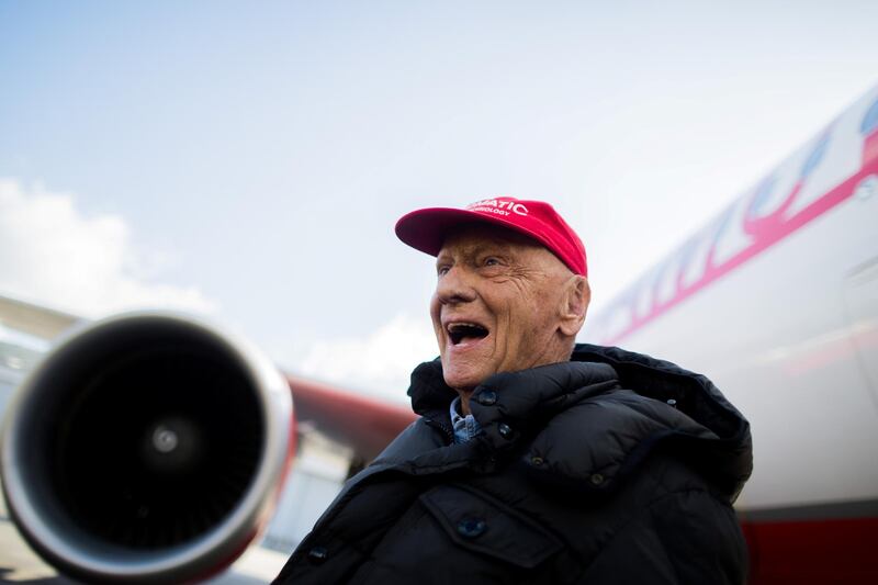 Austrian entrepreneur in the aviation sector and former Formula One champion Niki Lauda stands in front of an Airbus plane of his new Laudamotion airline in Duesseldorf, western Germany, on March 20, 2018. - As Irish no-frills airline Ryanair announced on March 20, 2018, it is planning to take over the majority interest of Laudamotion. (Photo by Rolf Vennenbernd / dpa / AFP) / Germany OUT