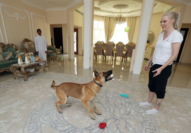 Denny enjoys some quality time with owner Tene Saarva, while her stepson, Abdulaziz Al Marzooqi, 14, looks on.