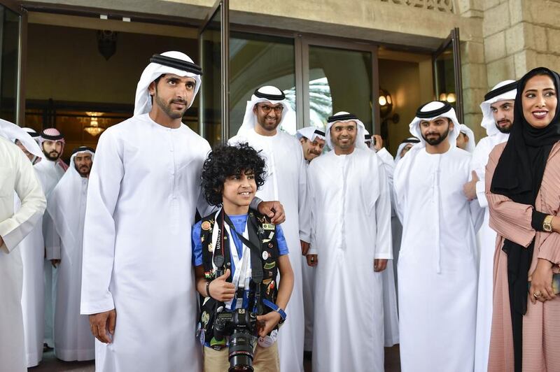 Sheikh Hamdan bin Mohammed, Crown Prince of Dubai, with a young photographer at the Arab Media Forum in Dubai, where the importance of youth to the media was stressed. Wam