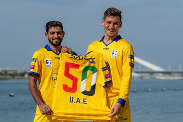 Farooq Muhammed (left) and Noor Ahmad,  Team Abu Dhabi, celebrate UAE's 50th National Day. 2nd December 2021. Photo: Abu Dhabi Cricket