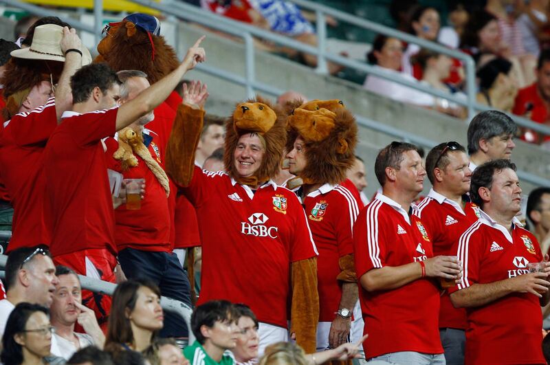 Supporters for British & Irish Lions react as they watch a friendly match against The Barbarians in Hong Kong June 1, 2013.   REUTERS/Bobby Yip  (CHINA - Tags: SPORT RUGBY) *** Local Caption ***  HKG16_RUGBY-_0601_11.JPG