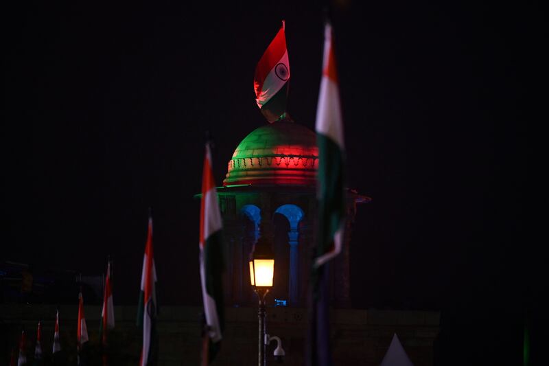The Indian flag is projected on to a dome next to the Rajpath boulevard in New Delhi. AFP
