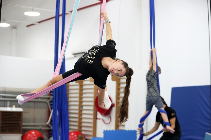 Trainer Ana Stasia demonstrates an aerial hammock trick