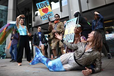 A protester in a mermaid costume outside the International Maritime Organisation in London. AFP