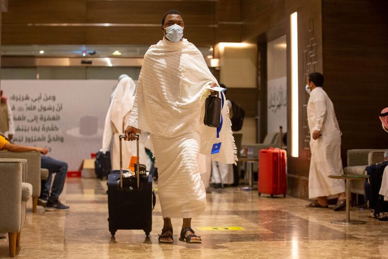 A muslim pilgrim pulls his luggage along in Makkah. REUTERS