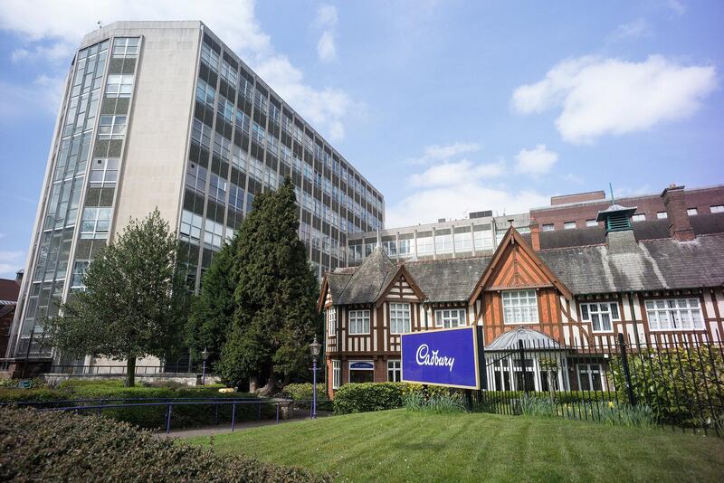 BIRMINGHAM, ENGLAND - APRIL 05:  The entrance to the Cadbury factory in Bournville on April 5, 2017 in Birmingham, United Kingdom. The Cadbury name is synonymous with chocolate throughout the world.John Cadbury began selling drinking chocolate in Birmingham in 1824 and opened a chocolate factory 1831. The business was developed further by his two sons and they went on to build the garden village of Bournville. The Cadbury family were famously Quakers and this influenced their business practices with no alcohol being sold in Bournville,They also helped to create the old age pension and what is now the RSPCA.Direct descendent James Cadbury has continued with the family interest in chocolate running lovecocoa.com which delivers luxury chocolate bars through the post.The Cadbury brand is now owned by American food giant Kraft.  (Photo by Christopher Furlong/Getty Images)