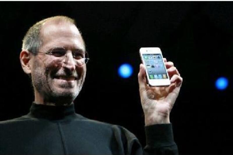 Steve Jobs, the chief executive of Apple, holds up the iPhone. Google, like William Tell, has Apple's flagship product firmly in its sights.