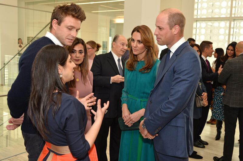 Britain's Prince William, Duke of Cambridge and Britain's Catherine, Duchess of Cambridge meet with MasterChef winner, Saliha Mahmood. AFP