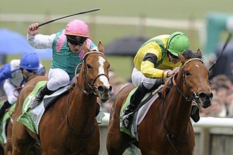 Special Duty, left, Jacqueline Quest vie for the 1,000 Guineas at Newmarket. Jacqueline Quest crossed the finish line first.