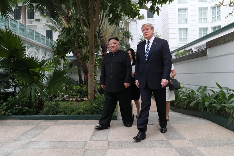 Kim Jong Un and Donald Trump talk in the garden of the Metropole hotel. Reuters