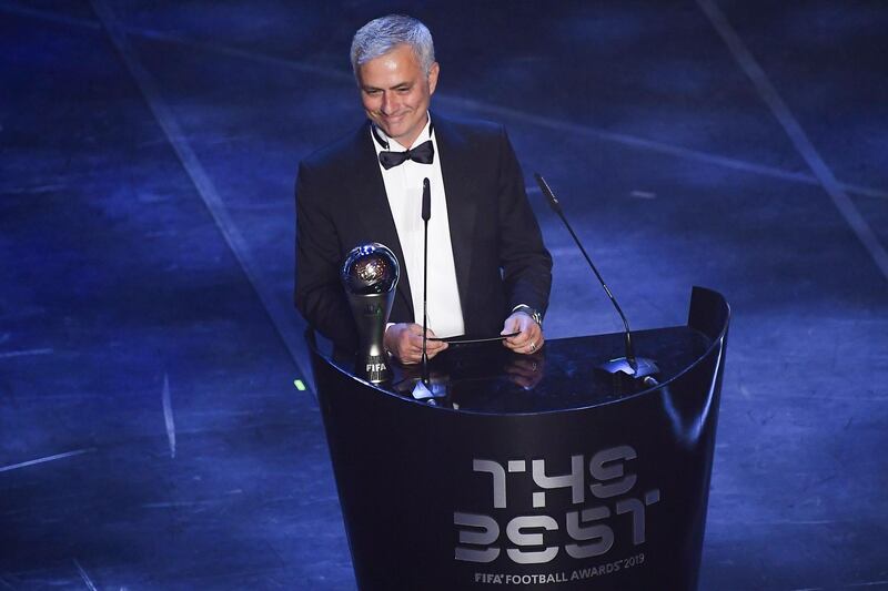 Portuguese coah Jose Mourinho presents the trophy for the Best FIFA Women's Coach of 2019 Award. AFP