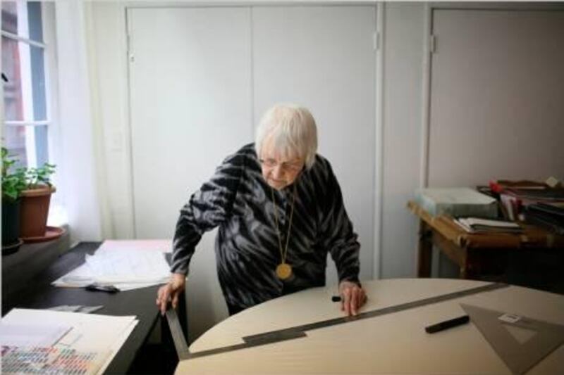 Carmen Herrera at work. She has painted for six decades, and since her first sale in 2004, collectors have avidly pursued her.  Photo Courtesy Todd Heisler/The New York Times