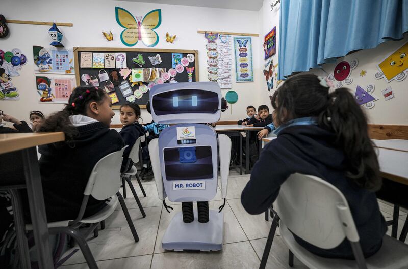 Palestinian pupils with the educational robot.