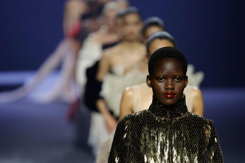 Models present creations by Ashi Studio during Paris Haute Couture week 
