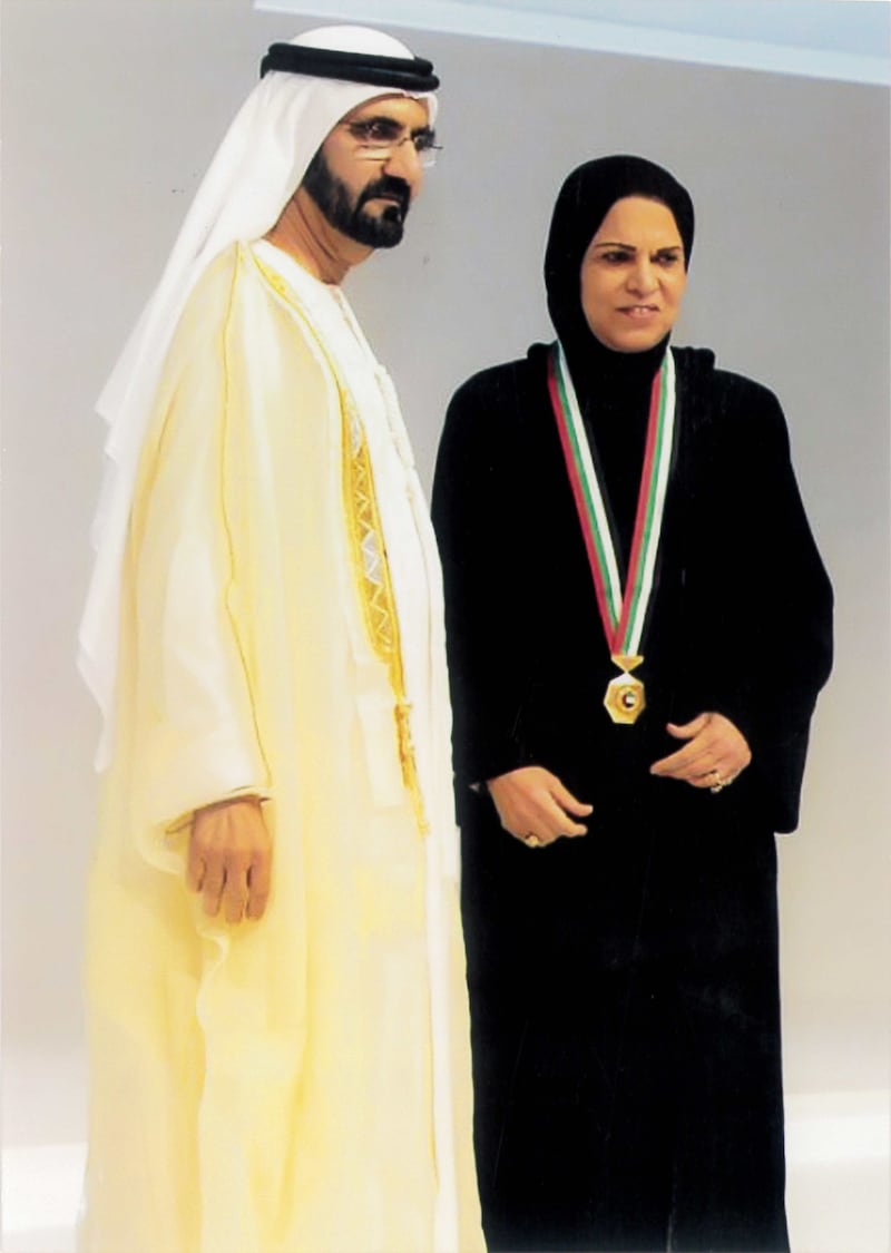 Aisha Al Sayyar receives an award from Sheikh Mohammed bin Rashid, Vice President and Ruler of Dubai, in 2014 for being the first Emirati woman to earn a doctorate. Photo: Aisha Al Sayyar