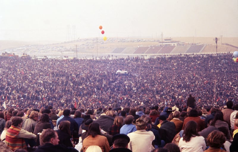 The racetrack's bleachers could not accommodate the rumoured number of 300,000 that the concert attracted. (Photo by William L. Rukeyser/Getty Images)