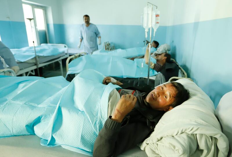 Wounded men receive medical treatment in a hospital after several mortars targeted a political gathering in downtown Kabul, Afghanistan. According to the ministry of health at least four people were killed and 21 others injured in the incident.  EPA