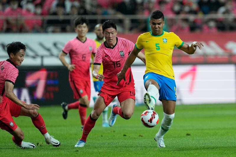 Brazil's Casemiro in action against South Korea's Hwang Ui-jo in Seoul on June 2, 2022. AP 