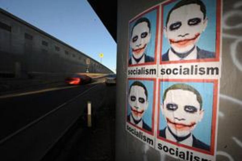 A poster depicting Barack Obama as The Joker, as seen in the Batman movie The Dark Knight pasted on a highway pillar in Los Angeles.