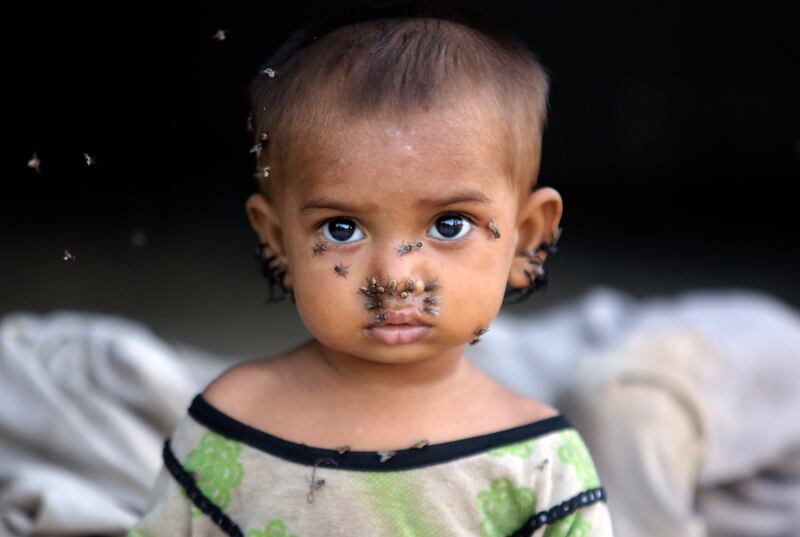 A girl displaced by monsoon flooding at a temporary tent housing camp for flood victims organised by the Chinese government, in Sukkur, Pakistan. AP