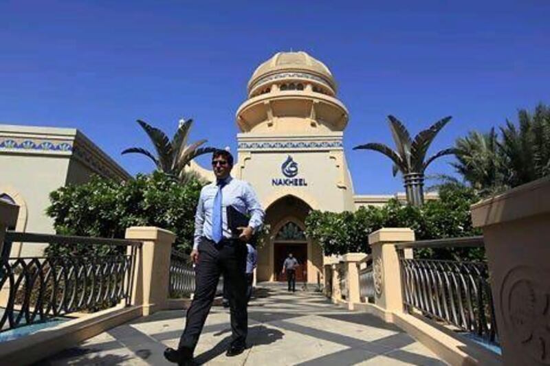 Nakheel said it had taken deposits on nearly Dh1bn of property for the first phase of villas it plans to build at its Jumeirah Park. Above, the company's sales office in Dubai. Satish Kumar / The National