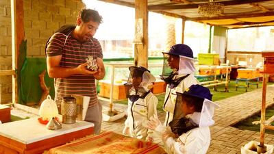 Juma Maki Juma Hamada at Hamada Bee teaching local children the basics of beekeeping