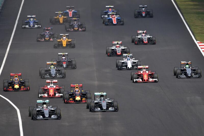 Mercedes-GP driver Lewis Hamilton, left, leads the race. Mohd Rasfan / AFP