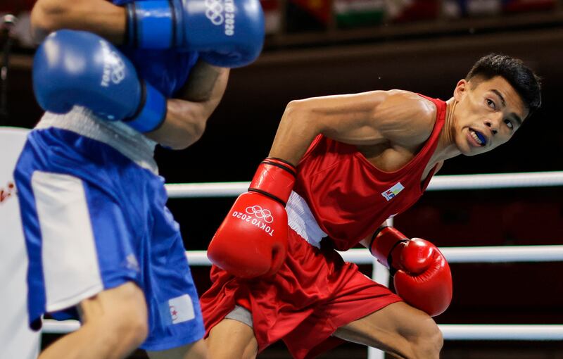 Carlo Paalam of the Philippines in action against Mohamed Flissi of Algeria in the men's flyweight.