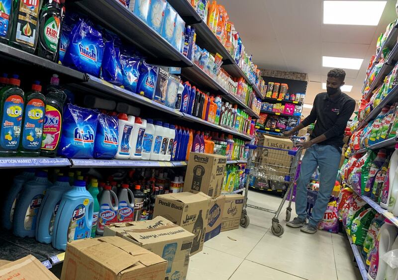 An employee works in a disinfectant section inside a market in the Cairo suburb of Maadi, Egypt. Reuters