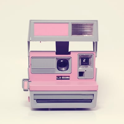Vintage antique camera pink. Getty Images