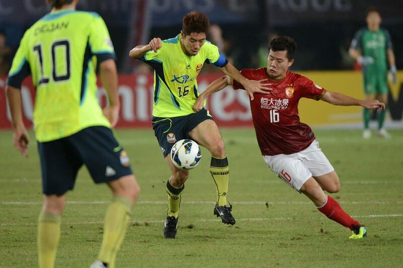 The AFC Champions League final was contested over two legs by FC Seoul and Guangzhou Evergrande, in red, in October and November. The competition has struggled to replicate the success and following of its more illustrious cousin in Europe, despite copying largely the same format. Ed Jones / AFP

