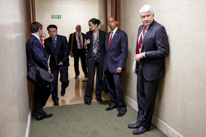 US Disarmament Ambassador Robert Wood and members of delegations stand in the corridor after leaving the conference in protest against Syrian presidency at the Conference on Disarmament, at the United Nations in Geneva, Switzerland. Salvatore Di Nolfi / EPA