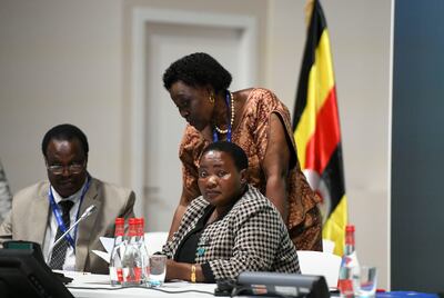 Beatrice Anywar, Uganda’s Environment Minister, standing, with Robinah Nabbanja, Prime Minister of Uganda, at Cop28.  Khushnum Bhandari / The National
