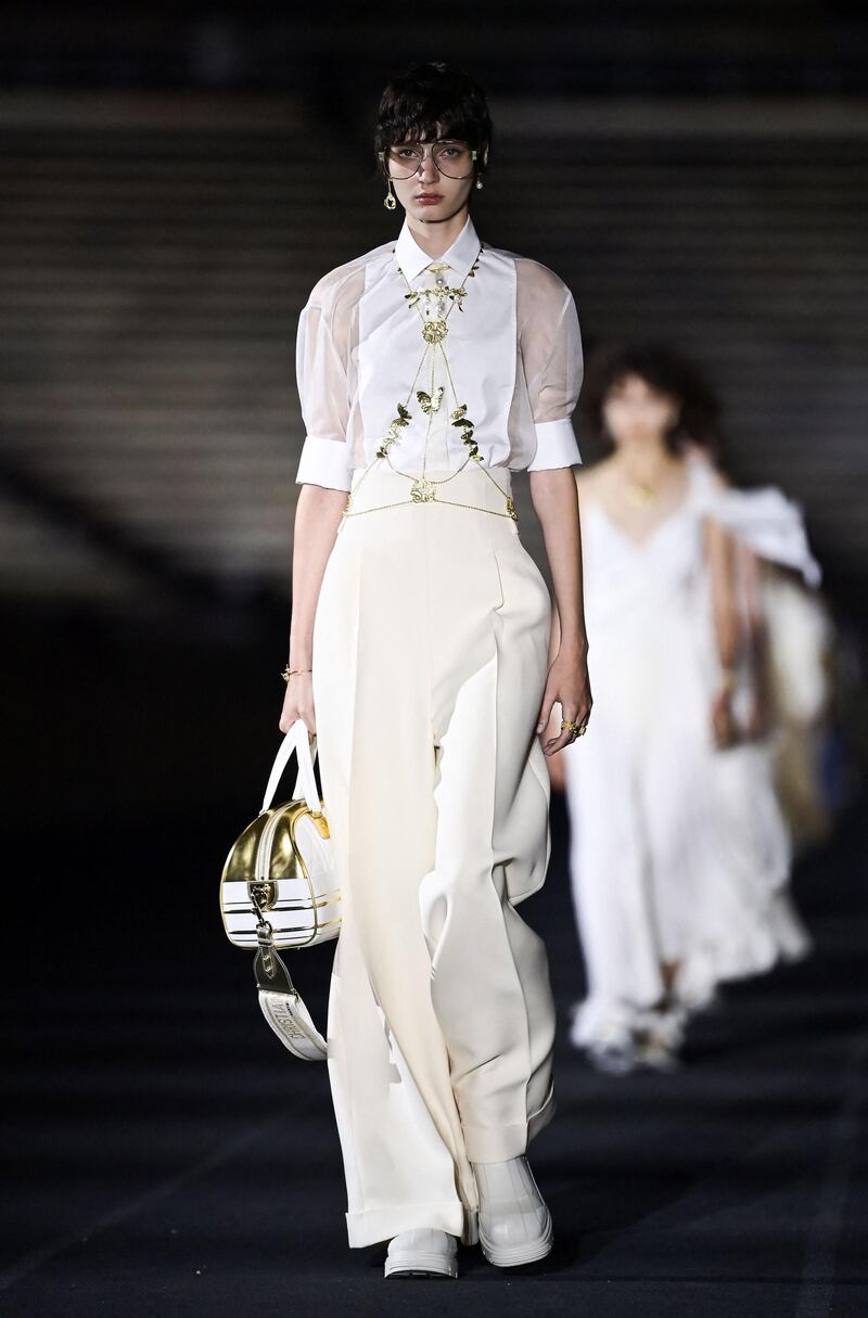 A model walks the runway during the Dior Cruise show 2022 at Panathenaic Stadium on June 17, 2021 in Athens, Greece. AFP