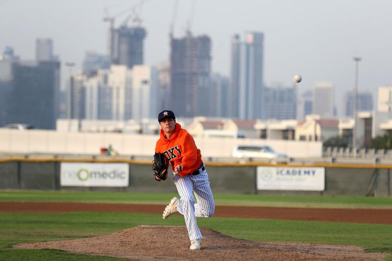 Dubai, United Arab Emirates - Reporter: Paul Radley. Sport. Baseball. Dubai Senior Baseball players (final year of school) have received offers to play baseball next season at university level in US and Canada. Ollie Duthie (blue) and Mattia Sparacino. Wednesday, March 24th, 2021. Dubai. Chris Whiteoak / The National