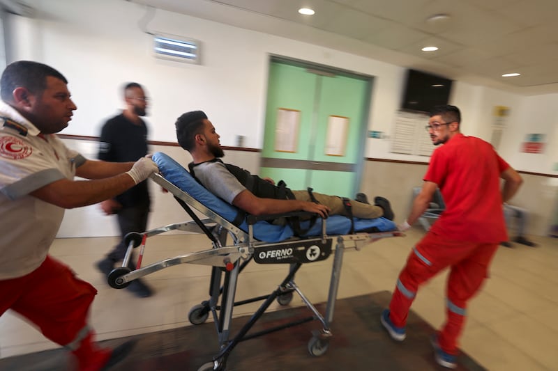 Members of the Palestinian Red Crescent transport an injured man to a hospital in Jenin. AFP