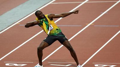 Usain Bolt adopts his trademark celebration after winning the Men's 200m Final at the London Olympics. PA