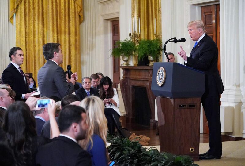 (FILES) In this file photo taken on November 7, 2018 US President Donald Trump (R) gets into a heated exchange with CNN chief White House correspondent Jim Acosta (C) as NBC correspondent Peter Alexander (L) looks on during a post-election press conference in the East Room of the White House in Washington, DC.
 
                               Media groups including Fox News joined CNN's legal battle on November 14, 2018 to restore the White House pass of a banned chief correspondent, as Donald Trump's administration argued it had a broad right to allow or deny press access to the US president.Fox, which is controlled by Trump ally Rupert Murdoch and often draws praise from the president, said the revoking of Jim Acosta's pass -- after he locked horns repeatedly with the US leader -- raises concerns over press freedom.
 / AFP / MANDEL NGAN
