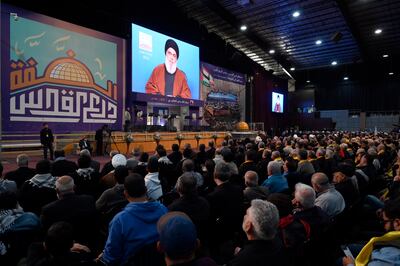 Hezbollah leader Hassan Nasrallah delivers a speech via video during a gathering to commemorate Al Quds Day in a suburb outside Beirut in mid-April. EPA